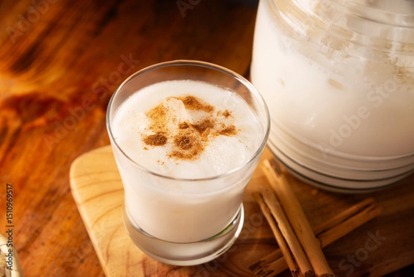 Fototapeta Agua de Horchata. Also known as horchata de arroz, it is one of the traditional fresh waters (aguas frescas) in Mexico, it is made with fresh water, rice and cinnamon.