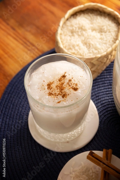 Fototapeta Agua de Horchata. Also known as horchata de arroz, it is one of the traditional fresh waters (aguas frescas) in Mexico, it is made with fresh water, rice and cinnamon.