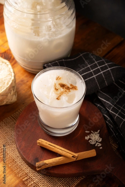 Fototapeta Agua de Horchata. Also known as horchata de arroz, it is one of the traditional fresh waters (aguas frescas) in Mexico, it is made with fresh water, rice and cinnamon.