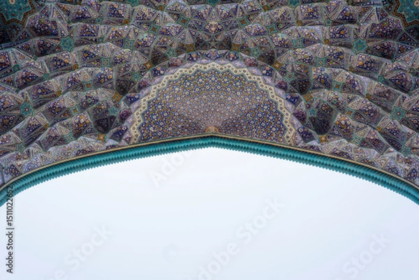 Fototapeta Intricate tilework and geometric patterns of the Shah Mosque in Esfahan, Iran, showcasing stunning Persian craftsmanship and vibrant Islamic art.