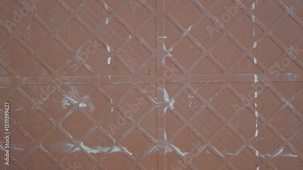 Fototapeta Close-up View of a Terracotta-Colored Tile with a Geometric Pattern and Imperfections