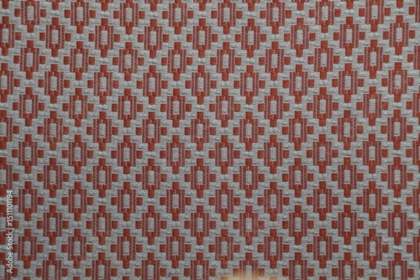 Fototapeta Detailed Close-Up of Woven Fabric with Geometric Red and Gray Pattern