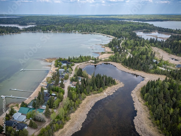 Fototapeta View of a lake with a small town on the shore