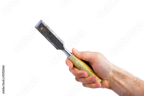 Fototapeta man's hand hold old carpenter's chisel with plastic handle isolated on white background
