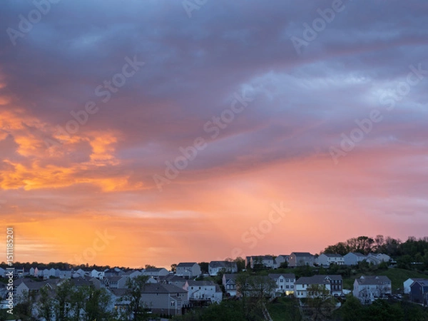 Obraz Vivid sunrise colors illuminate clouds over suburban houses outside Pittsburgh