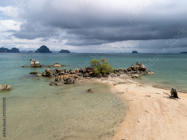 Fototapeta island with small beach at low tide in Krabi, Thailand