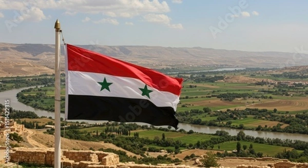 Fototapeta Waving Syrian Flag Symbolizing Ancient Civilizations Along the Fertile Orontes River Valley Landscape