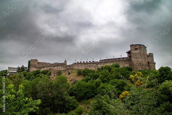 Fototapeta Imposing Templar Castle of Ponferrada Under a Dramatic Sky
