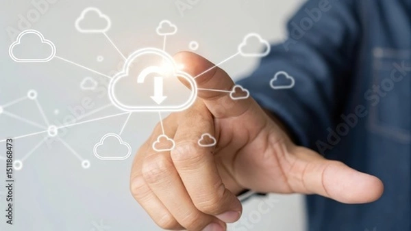 Obraz A hand pointing at a cloud symbol representing digital data upload and technology.