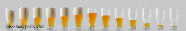 Fototapeta Collection of beer glasses in a row filled and consumed