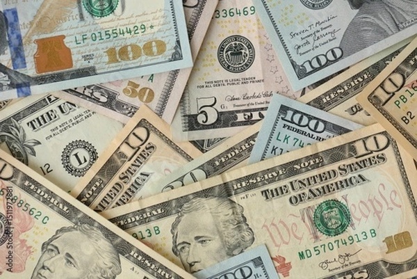 Fototapeta Stack of dollar bills. Hundred, fifty, twenty, ten, five dollars banknote close up