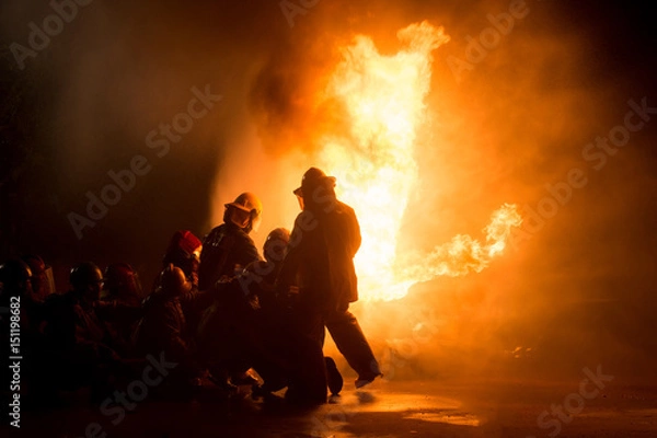 Obraz firefighters in teamwork operation