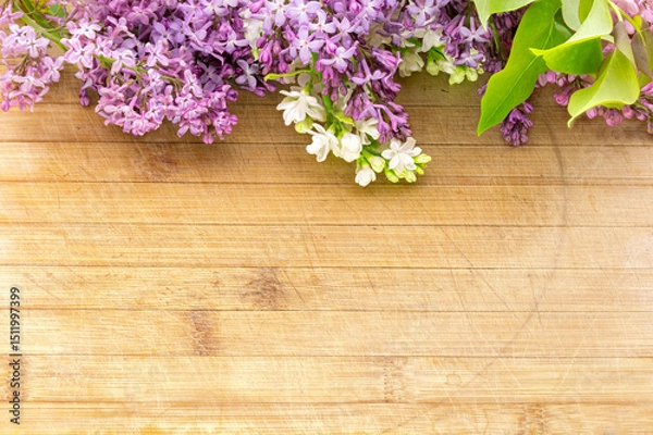 Fototapeta lilac flower arrangement on old board background with free space