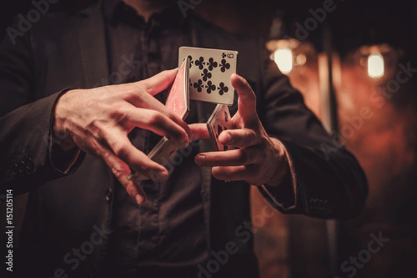 Fototapeta Man showing tricks with cards