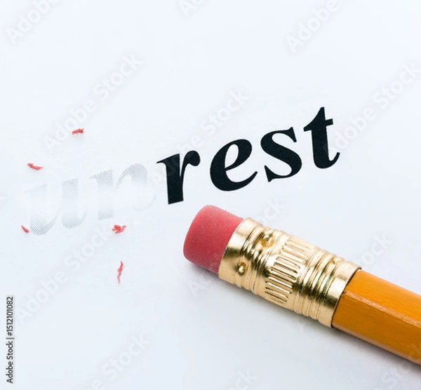 Fototapeta Word unrest rest and eraser close-up