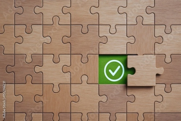 Obraz A wooden puzzle symbolizes strategic decision-making and problem solving in business revealing a check mark as a sign successful completion and achieved goals