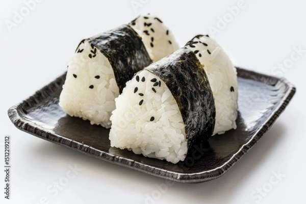 Obraz High Quality Image of Japanese Onigiri on Square Black Plate Isolated on White Background