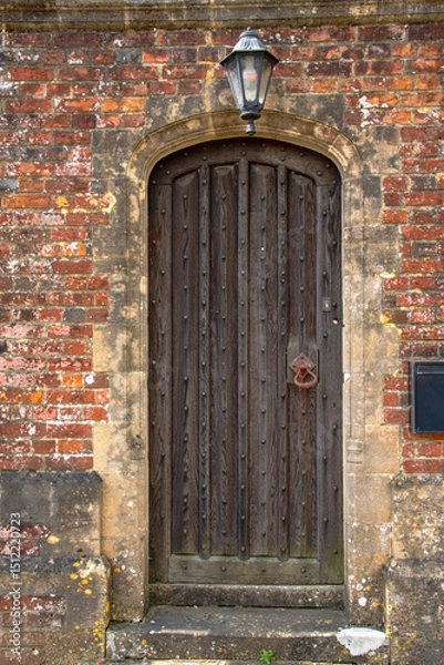 Obraz Old Rustic Wood Door with Overhead Lantern.