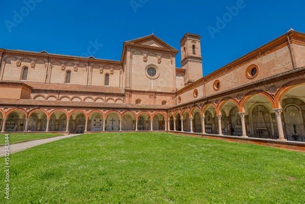 Fototapeta  Ferrara, Italy - May 17, 2025: Saint Christopher church with its large garden and cloister, part of the monumental complex of the Charterhouse of Ferrara, a historic landmark and tourist attraction