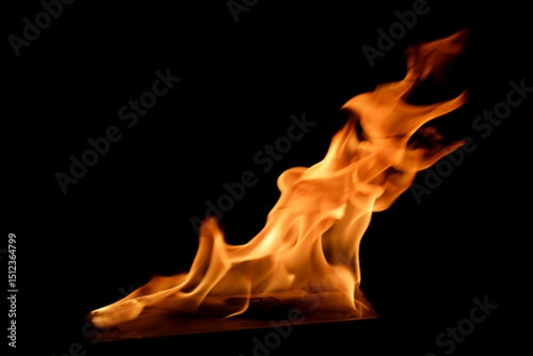 Fototapeta Intense Flames Dancing Brightly Against a Dark Background