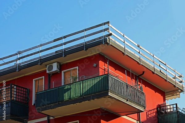 Fototapeta Fall protection barrier with wooden planks installed on the roof frame of condominium on the construction site during maintenance of roof