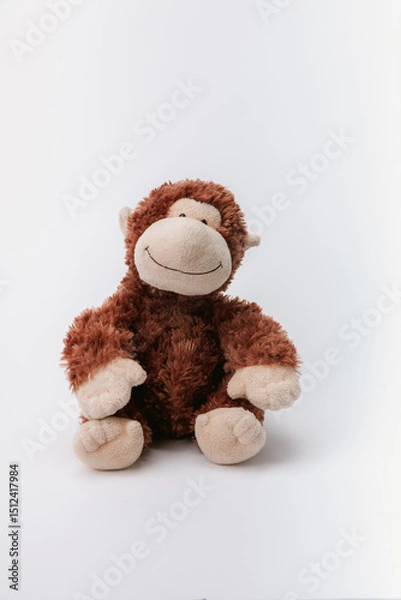 Obraz Monkey stuffed animal sitting on a white background