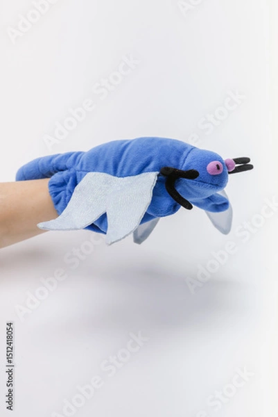 Obraz Blue bug hand puppet on a white backdrop