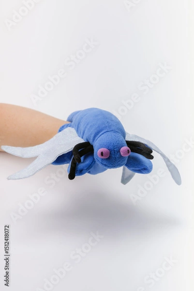Obraz Blue bug hand puppet on a white backdrop