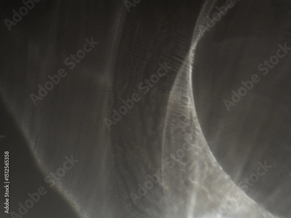 Fototapeta Monochrome caustic texture in light. Abstract caustic reflections on black. Can be used as overlay elements for design projects. 