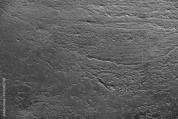 Fototapeta Closeup of an uneven black painted surface. The rough abstract texture for industrial backgrounds