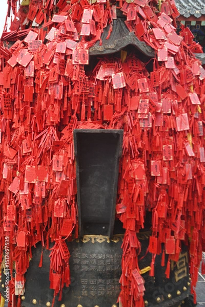 Obraz Red ribbons or cloth talismans tied to pillars in Taoist temples at Yuntaishan Geopark is the most beautiful geopark in Henan Province, China.It is listed as the first World Geopark in the world.