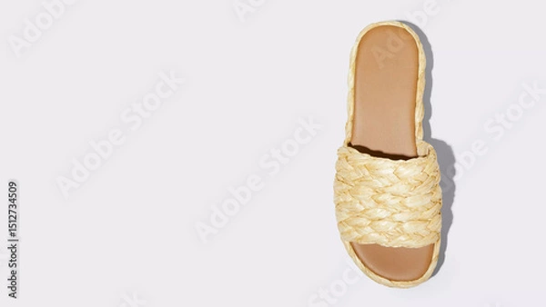 Obraz Stylish braided slide sandal in soft yellow shade perfect for summer wear and beach outings elevating casual fashion