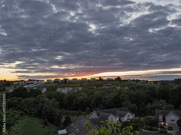 Obraz Breathtakingly colorful sunset over suburban houses on a summer evening in Pennsylvania, USA.