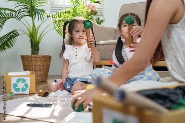 Fototapeta Family Fun and Environmental Awareness. Kids crafting trees from recycled materials.