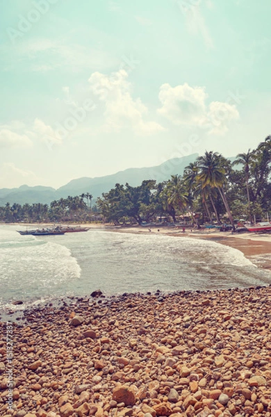 Fototapeta Scenic beach on Palawan island, color toning applied, Philippines.