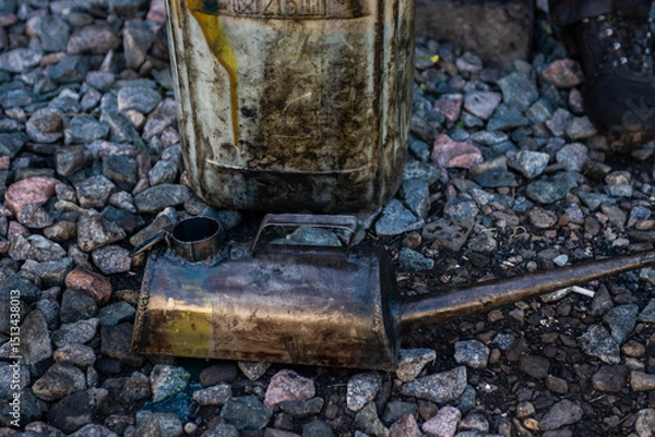 Fototapeta A metal watering can (oil can) for pouring grease into various mechanisms and systems of the locomotive and a metal canister. 