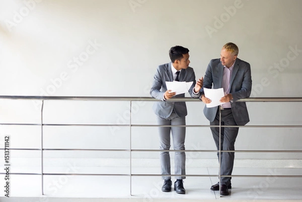 Fototapeta Business meeting : Business colleagues talking in the office. Group of business man talking in modern office building