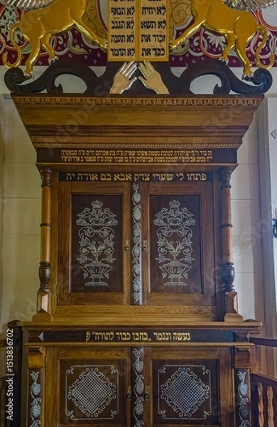 Obraz A richly decorated wooden cabinet for storing Torah scrolls in the reconstructed synagogue at the open-air museum in Sanok