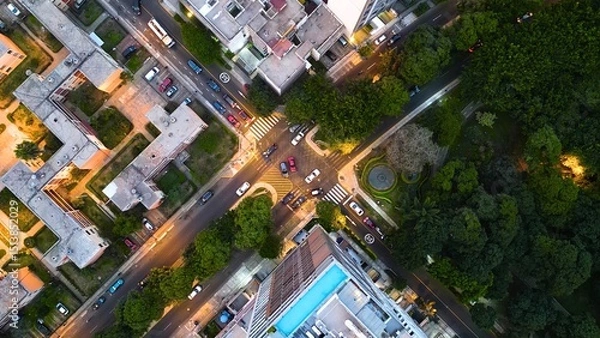 Fototapeta Top-down drone view of an avenue intersection in Lince district, Lima, on a quiet night.