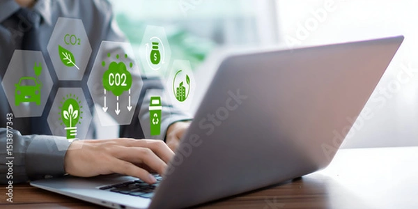 Fototapeta A business person using laptop with ESG environment social governance investment business concept, co2 on visual screen.