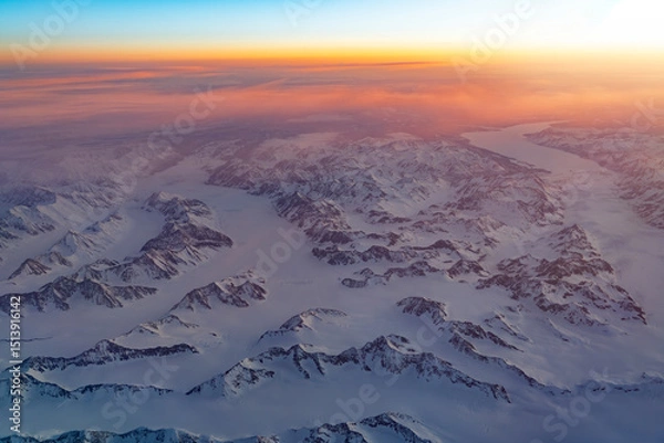 Fototapeta Aerial view of snow mountain and frozen river in colorful morning sunlight in Alaska