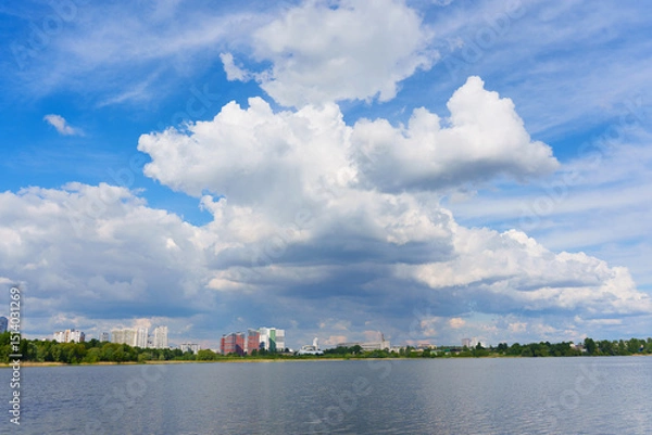 Fototapeta Scenic View Of Kyiv Skyline Reflected In Calm Water Under Cloudy Sky