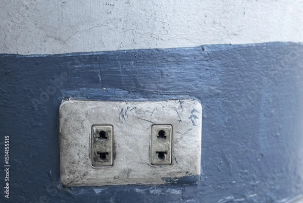 Fototapeta Old electrical power socket plug outlet on concrete wall.