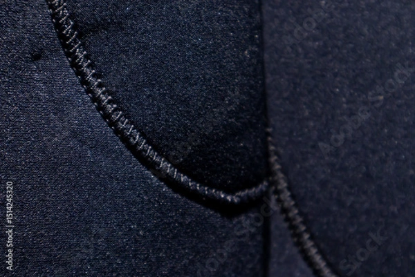 Obraz Sewing the edges of knitted garments and detailed fabrics