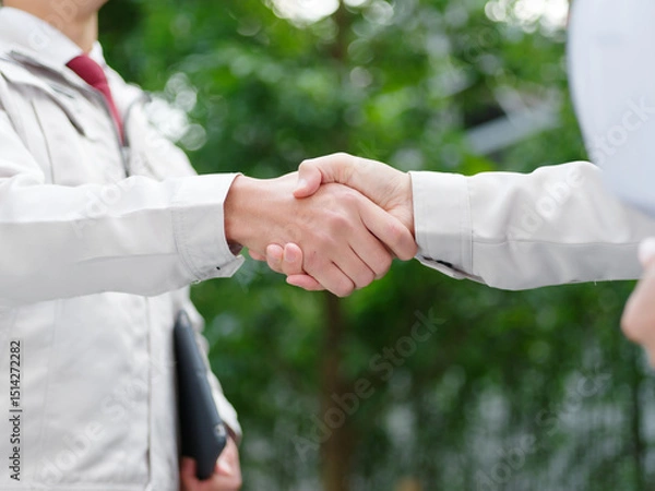 Fototapeta 作業着男性の握手