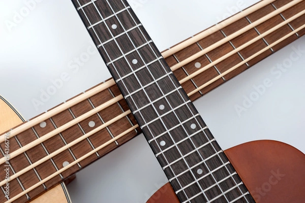 Obraz Four-string bass ukulele with wooden body and built-in tuner and pickup.