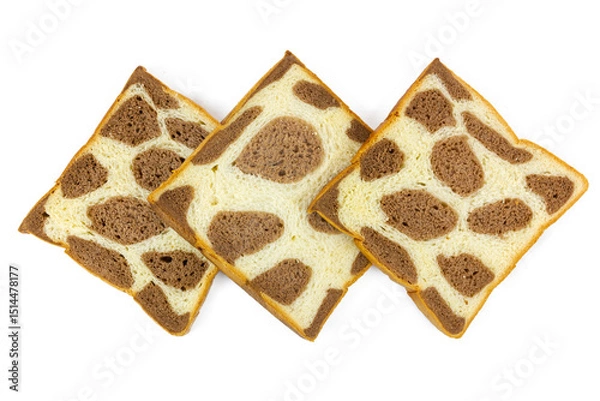 Obraz Three slices of uniquely patterned bread, resembling giraffe or leopard spots with light and dark brown variations, are arranged neatly on a clean white background.