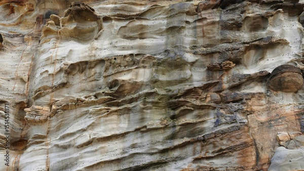 Fototapeta Rock formations displaying unique textures and patterns at a natural site during daylight hours