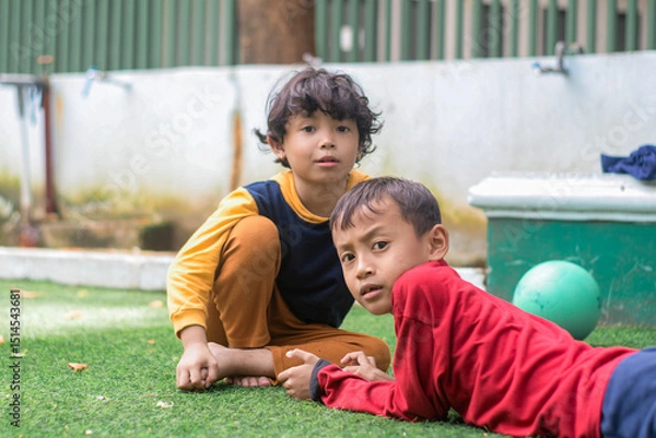 Obraz Portrait of two little children at park full of grass