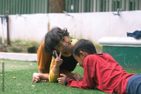 Obraz Portrait of two little children at park full of grass